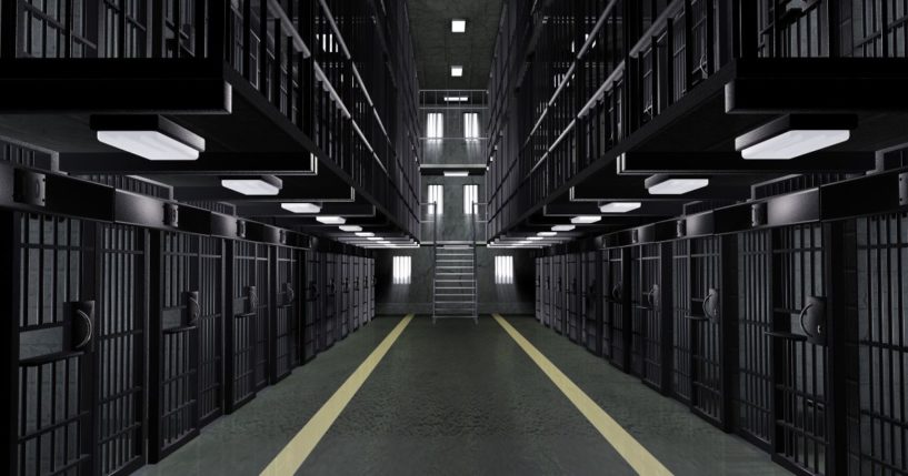 This stock image shows the inside of a prison with empty cells.