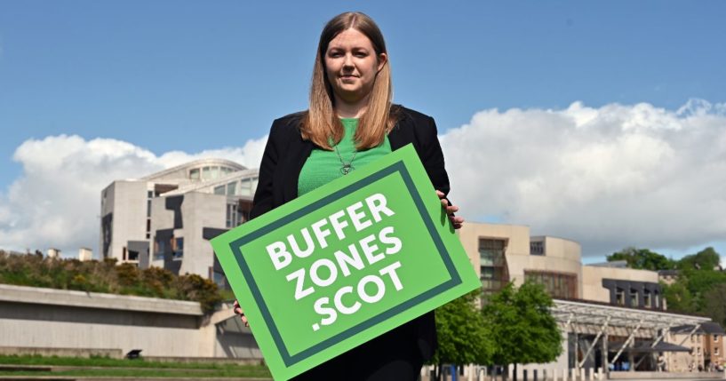 Scottish Green Party member Gillian Mackay is seen in a file photo from May 2022, holding a placard outside the Scottish Parliament in Edinburgh, Scotland, in support of the creation of buffer zones around abortion clinics.