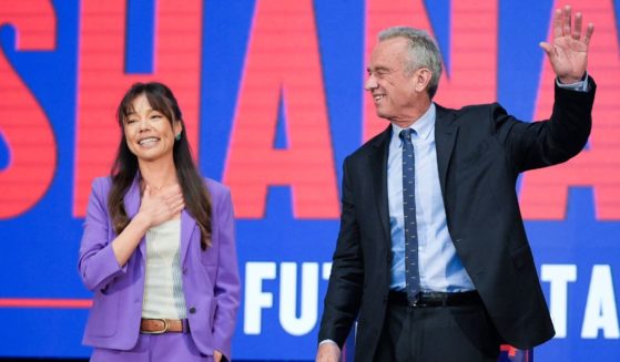 Then-independent Presidential candidate Robert F. Kennedy Jr. right, waves on stage with Nicole Shanahan, left, after announcing her as his running mate, during a campaign event in Oakland, California, on March 26, 2024.