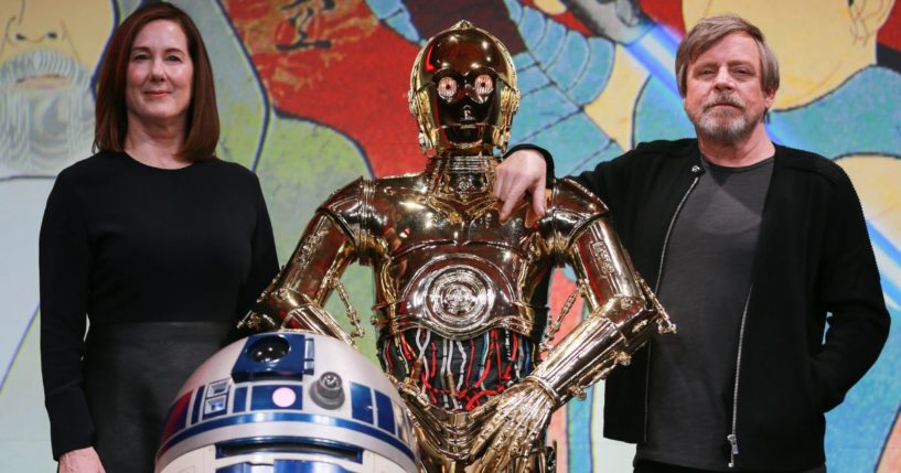 Producer Kathleen Kennedy, left, C-3PO, center, and Mark Hamill, right, attend the 