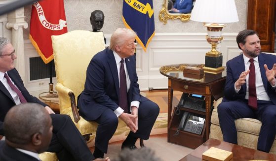 President Donald Trump, center, called on Vice President J.D. Vance, right, to elaborate for British Prime Minister Keir Starmer, left, on Vance's remarks about U.K. restrictions on free speech Thursday during a meeting in the Oval Office at the White House.