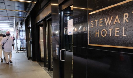 The Stewart Hotel in midtown Manhattan is seen in October of 2022, when it reportedly was being used as an intake and assessment center for recently arrived immigrants. Elon Musk said Monday his Department of Government Efficiency learned that the Federal Emergency Management Agency sent $59 million for "luxury hotels in New York City to house illegal migrants."