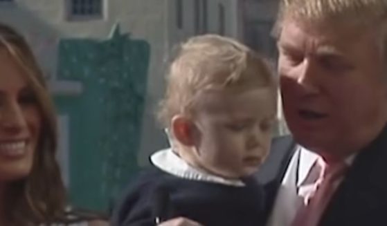 Video shows now-President Donald Trump, right, speaking about baby Barron Trump, center, calling him "strong," "smart," "tough," "vicious," and "violent."