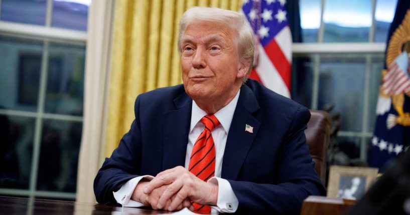 President Donald Trump reacts to a question from a reporter after signing a series of executive orders including tariffs on steel and aluminum.