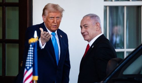 President Donald Trump, left, greets Israeli Prime Minister Benjamin Netanyahu, right, at the West Wing of the White House in Washington, D.C., on Tuesday.