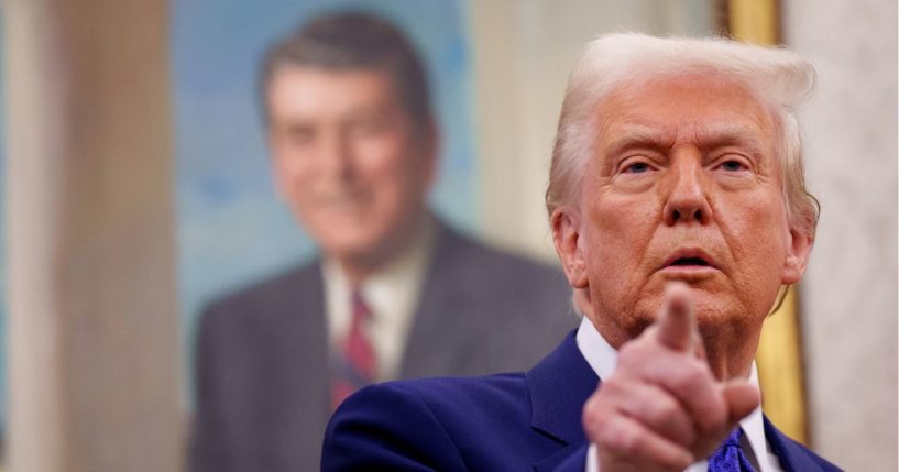 President Donald Trump, seen in a Feb.12 photo in the Oval Office at the White House, had some bad news to share with the U.S. attorneys from the Biden administration.