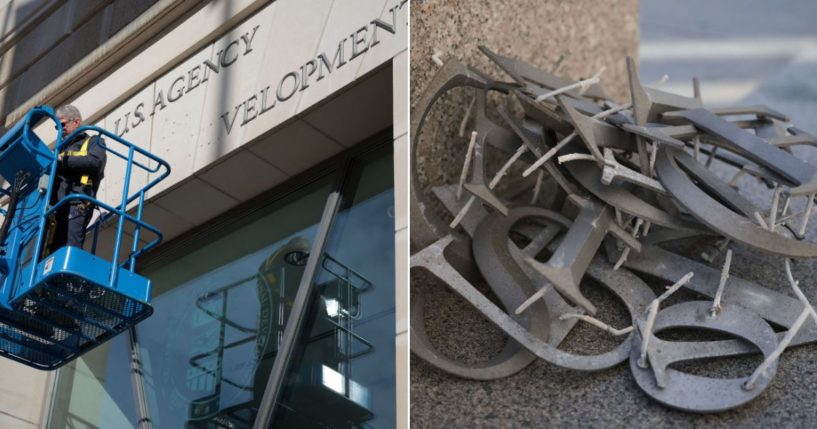 A worker, left, removes the signage from the United States Agency for International Development on the agency's headquarters in Washington, D.C. on Feb.7. The discarded letters are seen at right. Google Trends noted an alarming uptick in troubling search terms in the D.C. area after the move.