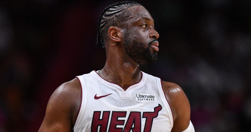 Dwyane Wade, then of the Miami Heat, looks for the ball in the second half of the game against the Charlotte Hornets in Miami, Florida, on March 17, 2019.