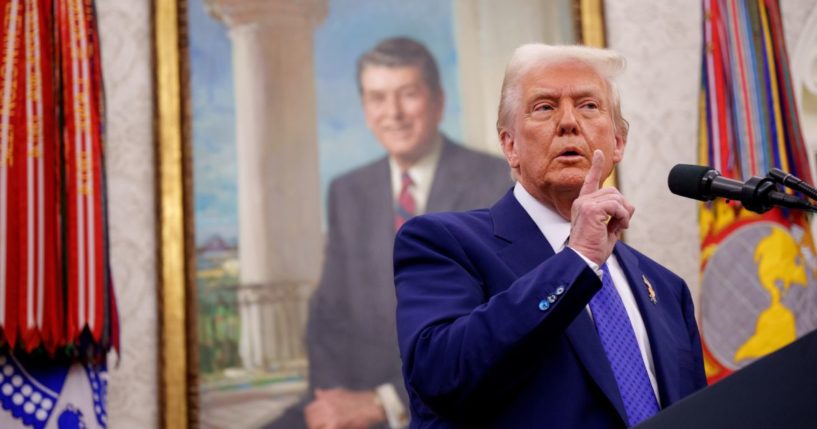 U.S. President Donald Trump gestures as he takes a question from a reporter after Tulsi Gabbard is sworn in as Director of National Intelligence in the Oval Office at the White House on February 12, 2025 in Washington, DC.