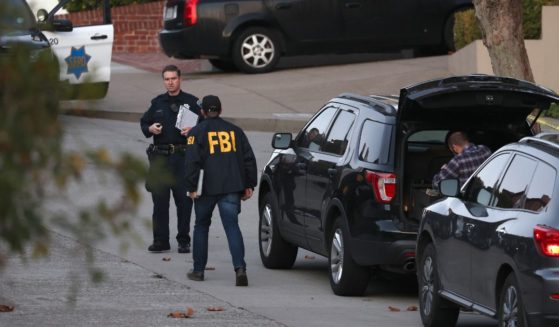 San Francisco police officers and F.B.I. agents gather in front of the home of U.S. Speaker of the House Nancy Pelosi (D-CA) on October 28, 2022 in San Francisco, California.