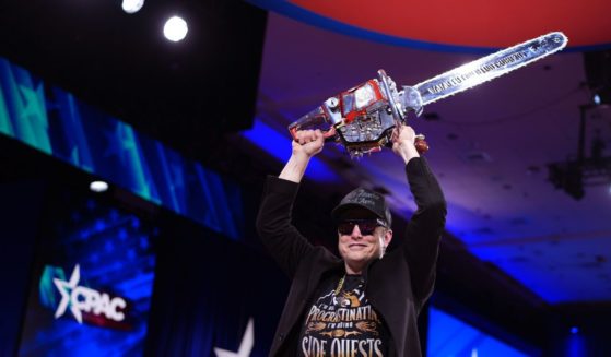 CEO of Tesla and SpaceX Elon Musk leaves the stage holding a chainsaw after speaking at the Conservative Political Action Conference (CPAC) at the Gaylord National Resort Hotel And Convention Center on February 20, 2025 in Oxon Hill, Maryland.