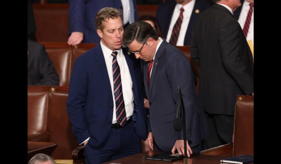 Speaker Mike Johnson (R-LA) (R) talks to Rep. Andy Ogles (R-AZ) as they arrive for the first day of the 119th Congress in the House Chamber of the U.S. Capitol Building on January 3, 2025 in Washington, DC.