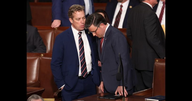 Speaker Mike Johnson (R-LA) (R) talks to Rep. Andy Ogles (R-AZ) as they arrive for the first day of the 119th Congress in the House Chamber of the U.S. Capitol Building on January 3, 2025 in Washington, DC.