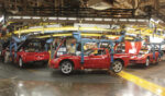 A line of red Corvettes pass through GM's Bowling Green Assembly Plant in Bowling Green, Kentucky, on March 24, 2009.