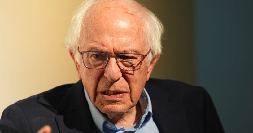 Sen. Bernie Sanders chats with a reporter before speaking during a stop of the "Fighting Oligarchy" tour in Denver, Colorado, on Friday.
