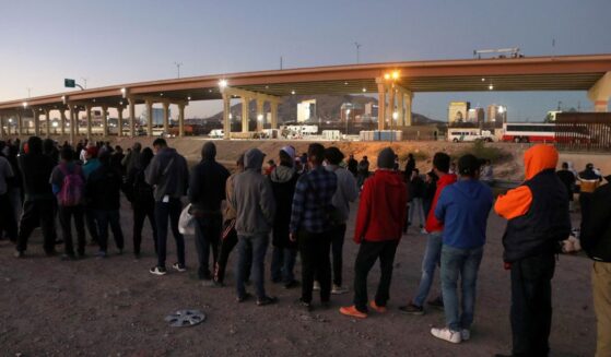 Venezuelan migrants stand in front of the U.S. Border Patrol operations post across the Rio Grande river n Ciudad Juarez, state of Chihuahua, Mexico, on Oct. 25, 2022.