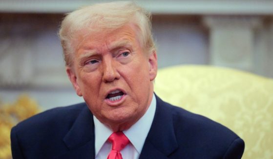 President Donald Trump answers reporters' questions while hosting Irish Taoiseach Micheal Martin in the Oval Office at the White House in Washington, D.C., on Wednesday.