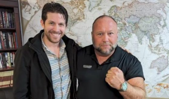 InfoWars host Alex Jones, right, praised Jamie White's work for the organization when he announced White's untimely death Monday.