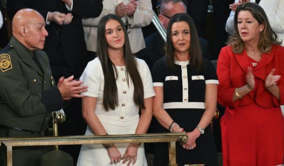 Allyson Phillips, second from right, and Lauren Phillips, second from left, mother and sister of Laken Riley, stand as they are recognized by President Donald Trump during Trump's address to a joint session of Congress in Washington, D.C., on Tuesday.