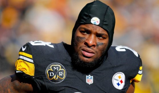 Le'Veon Bell, then of the Pittsburgh Steelers, looks on against the Jacksonville Jaguars during the first half of the AFC Divisional Playoff game in Pittsburgh, Pennsylvania, on Jan. 14, 2018.