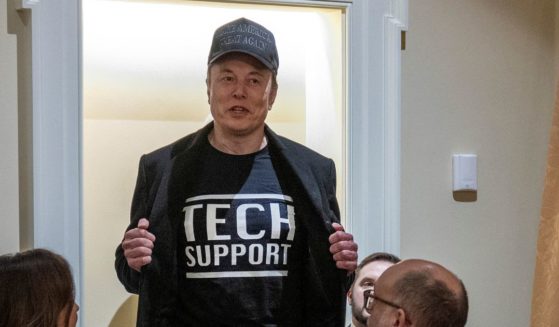 Leader of the Department of Government Efficiency Elon Musk wears a shirt that says "Tech Support" as he speaks during the first Cabinet meeting of President Donald Trump's second term at the White House on Feb. 26, 2025.