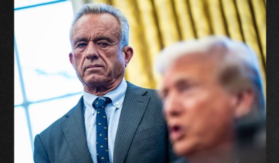 Secretary of Health and Human Services Robert F. Kennedy Jr. watches as President Donald J Trump signs Executive Orders and speaks with reporters in the Oval Office at the White House on Feb 25 in Washington, D.C.