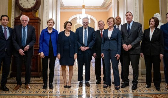 Senate Democratic leadership - Sens. Brian Schatz, Bernie Sanders, Elizabeth Warren, Amy Klobuchar, Senate Majority Leader Chuck Schumer, Senate Majority Whip Richard Durbin, Tammy Baldwin, Cory Booker, Mark Warner, Catherine Cortez Masto, and Chris Murphy - poses for photo in the U.S. Capitol in Washington, D.C., on Dec. 3.