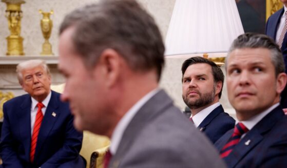 President Donald Trump, U.S. National Security Adviser Michael Waltz, Vice President J.D. Vance, and Defense Secretary Pete Hegseth are seen in an Oval Office meeting in a file photo dated March 13.