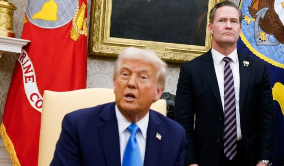 President Donald Trump, seen with National Security Adviser Michael Waltz in a Feb. 4 photo, defended Waltz after a reporter was inadvertently added to a texting group consisting of high-level Trump administration officials discussing military action in Yemen.