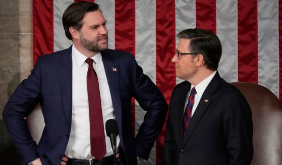 Vice President J.D. Vance, left, and Speaker of the House Mike Johnson, right, arrive before President Donald Trump addresses a joint session of Congress in the House chamber at the U.S. Capitol in Washington, D.C., on Tuesday. (Julia Demaree Nikhinson / AP)