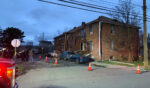 Detroit fire crews work on the scene after an apartment explosion in Detroit on Monday.