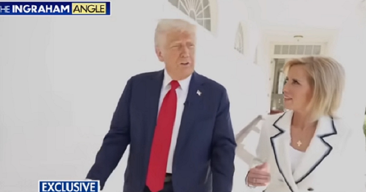 President Donald Trump is pictured walking at the White House with Fox News host Laura Ingraham.