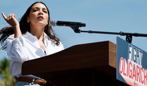 Rep. Alexandria Ocasio-Cortez speaks during a stop on the "Fighting Oligarchy" tour with Sen. Bernie Sanders in Los Angeles, California, on April 12.