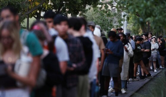 Voters wait to vote before the polls close at Arizona State University in Tempe , Arizona, on Nov. 5.