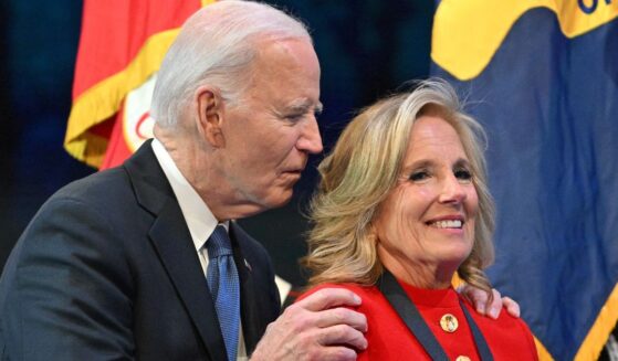Then-President Joe Biden grabs then-first lady Jill Biden after she received a medal for distinguished public service at a Department of Defense Commander in Chief Farewell Ceremony at Joint Base Myers-Henderson Hall in Arlington, Virginia, on Jan. 16.