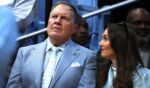 North Carolina Tar Heels football head coach Bill Belichick and his girlfriend Jordon Hudson look on during the first half of the March 8 game between the North Carolina Tar Heels and the Duke Blue Devils in Chapel Hill, North Carolina.