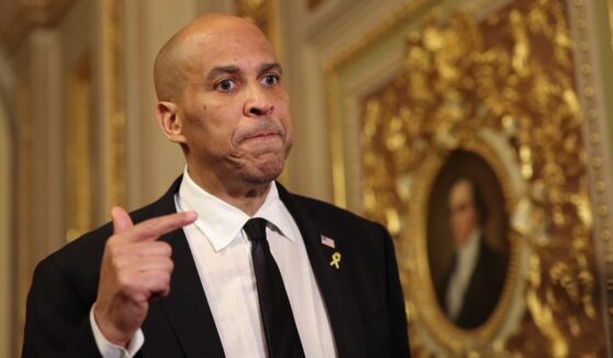 Sen. Cory Booker, a New Jersey Democrat, speaks to reporters as he leaves the Senate Chamber after delivering a record-setting floor speech at the nation's Capitol Tuesday.