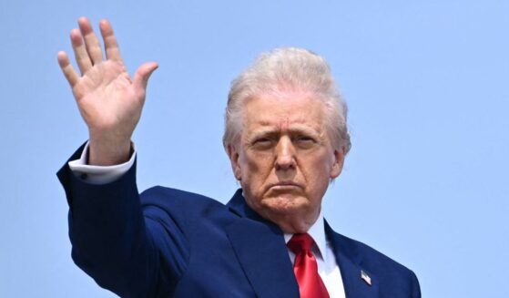 President Donald Trump waves as he boards Air Force One at Joint Base Andrews in Maryland on Thursday.