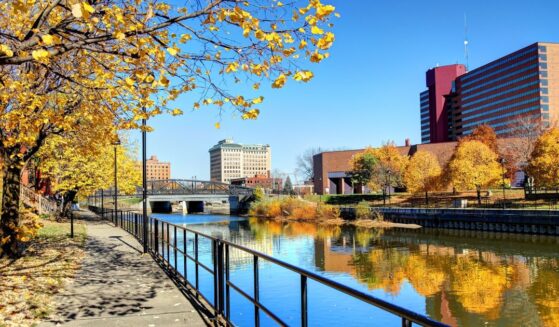 Autumn colors reflecting on the Flint River in downtown Flint, Michigan.