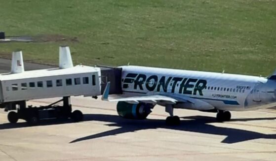 The Frontier jet was parked away from the terminal and 91 passengers were evacuated before the aircraft was searched.