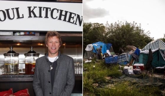 Musician and community activist Jon Bon Jovi, left, is seen at the grand opening celebration of one of his New Jersey Soul Kitchen restaurants in a 2011 photo. A local mayor has complained the rocker's efforts have caused homeless individuals to flood the town of Toms River, overwhelming the available resources.