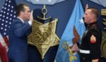 Medal of Honor recipient Sgt. Dakota Meyer is sworn in by Secretary of Defense Pete Hegseth during a reenlistment ceremony at the Pentagon on April 17, 2025, in Arlington, Virginia.