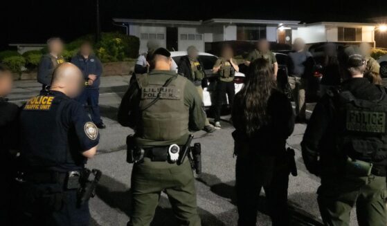 FBI agents and police officers during the operation to arrest Aliakbar Mohammed Ali.