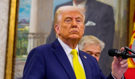 U.S. President Donald Trump, accompanied by Health and Human Services Secretary Robert F. Kennedy Jr. (L), takes a question from a reporter during a swearing in ceremony for Dr. Mehmet Oz as Medicare and Medicaid Services Administrator in the Oval Office at the White House on April 18, 2025 in Washington, DC.