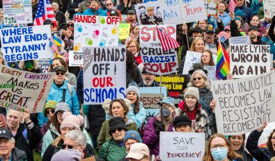 Thousands of demonstrators gather on Boston Common during the "Hands Off Massachusetts! Rally/March" in Boston, Massachusetts, on April 5, 2025.