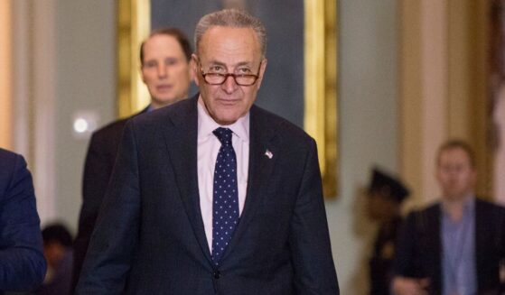 Senate Minority Leader Chuck Schumer heads to speak to the press after a luncheon on Dec. 19, 2017, in Washington, D.C.