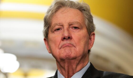 Sen. John Kennedy listens to Sen. John Hoeven speak to reporters following the weekly Senate Republican caucus policy luncheon at the U.S. Capitol in Washington, D.C., on Feb. 25.