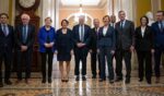 Senate Democratic Leadership - Sens. Brian Schatz, Bernie Sanders, Elizabeth Warren, Amy Klobuchar, Senate Majority Leader Chuck Schumer, Senate Majority Whip Richard Durbin, Tammy Baldwin, Cory Booker, Mark Warner, Catherine Cortez Masto, and Chris Murphy - pose for a group photo in the U.S. Capitol on Dec. 3.