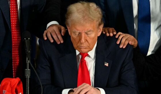 Donald Trump prays during a roundtable discussion with Latino community leaders at Trump National Doral Miami resort in Miami, Florida, on Oct. 22.