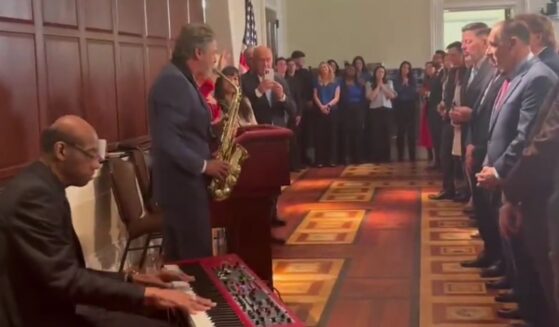 When the musicians started playing "Amazing Grace," everyone in the room rose to their feet.